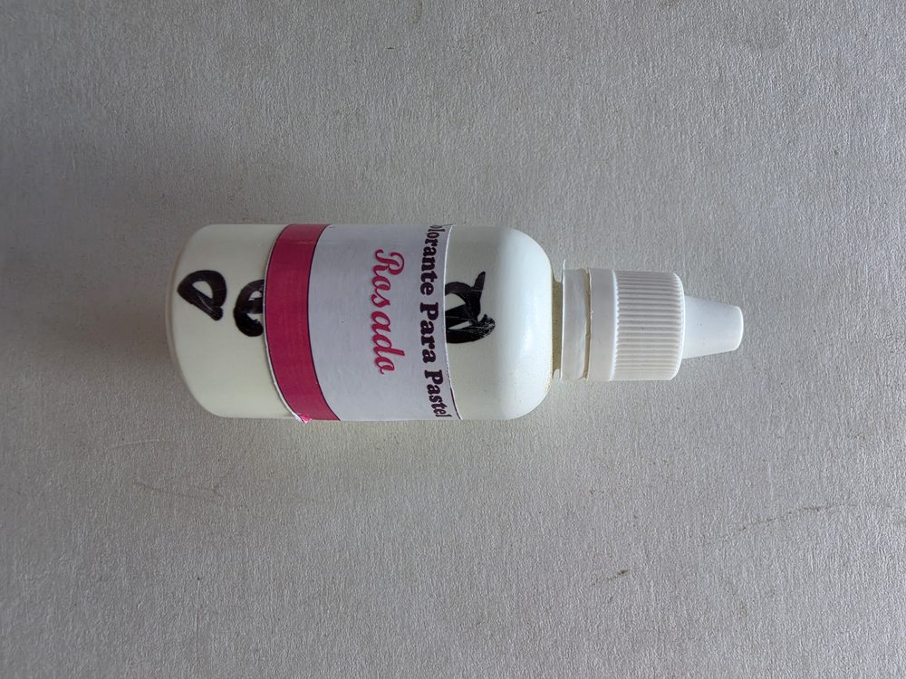 Frasco gotero blanco de colorante para pastel color rosado, con banda