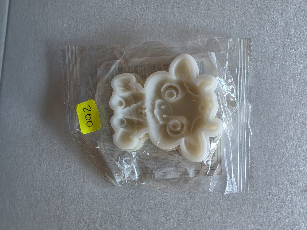 Molde de silicón blanco con figura de cara de osito o animalito