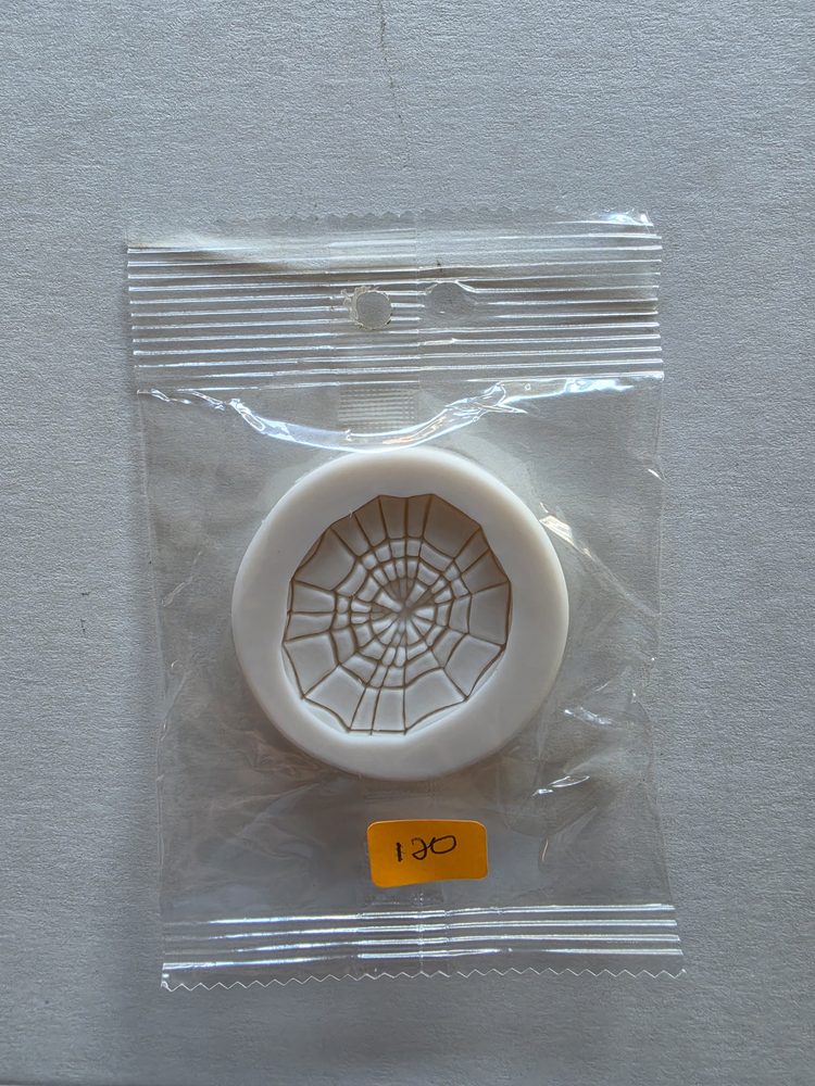 Molde de silicón blanco redondo con textura de telarana
